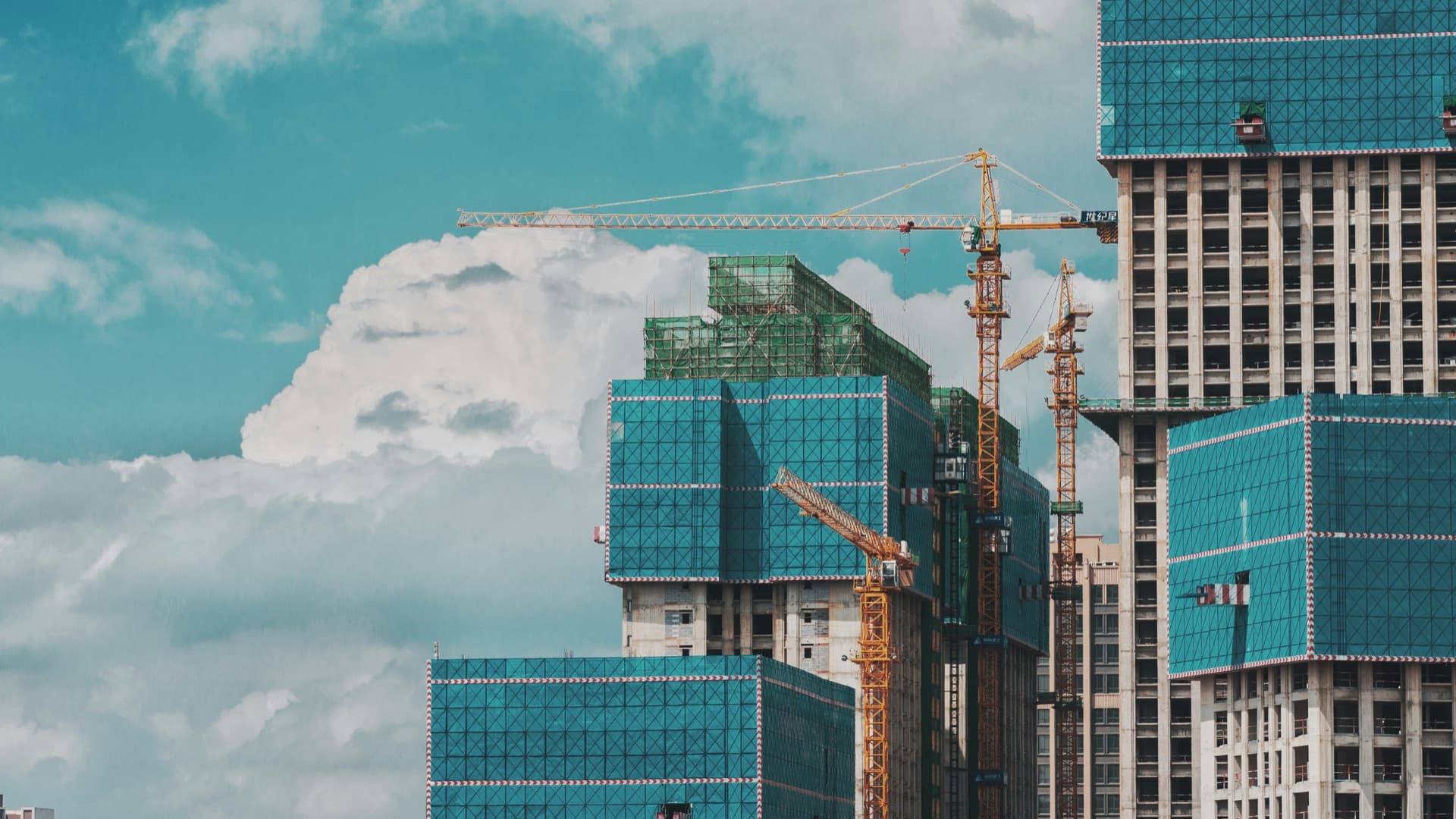 Construction site with cranes and scaffolding